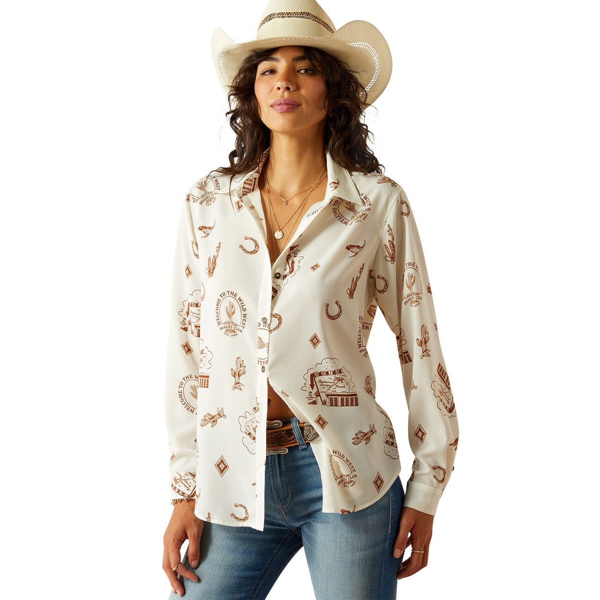 Woman wearing a white shirt with cowboy pattern and jeans on a white background