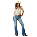 Woman wearing a white cowboy shirt and blue jeans on a white background