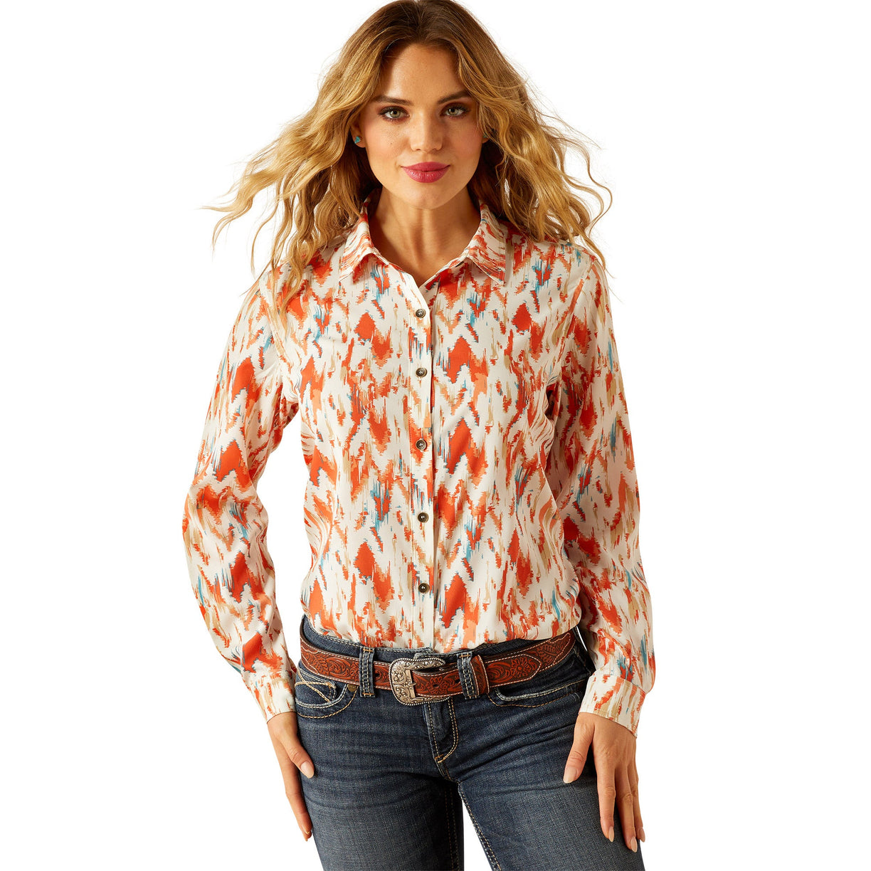 Woman wearing a colorful patterned shirt and jeans on a white background