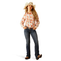 Woman wearing a patterned shirt, jeans, and a cowboy hat on a white background