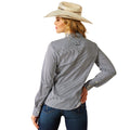 Woman wearing a gray striped shirt and blue jeans with a beige cowboy hat on a white background