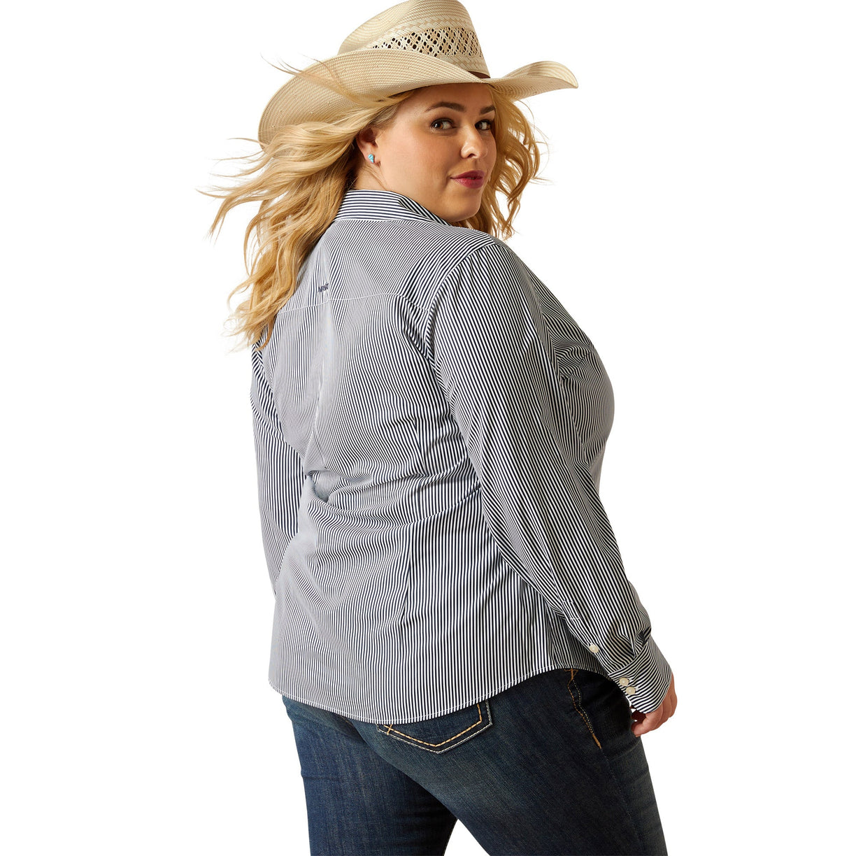 Woman wearing a striped shirt, jeans, and a cowboy hat on a white background