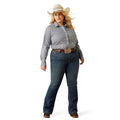Woman wearing a gray shirt, blue jeans, and a cowboy hat on a white background