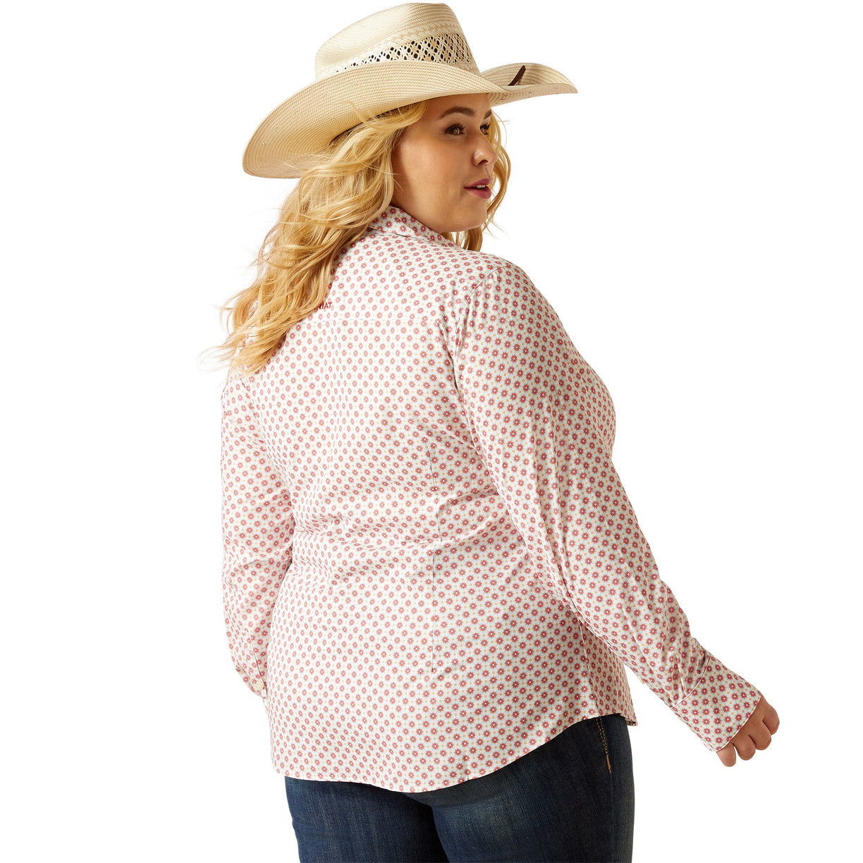 Woman wearing a pink patterned shirt and beige cowboy hat on a white background