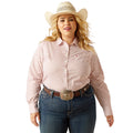 Woman wearing a patterned shirt, jeans, and a cowboy hat on a white background