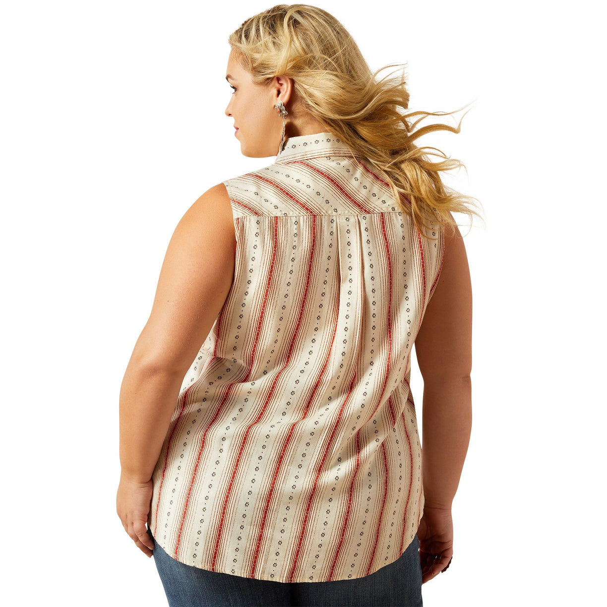 Woman wearing a sleeveless striped shirt and denim with a cowboy hat on a white background