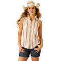 Woman wearing a sleeveless striped shirt and denim shorts with a cowboy hat on a white background