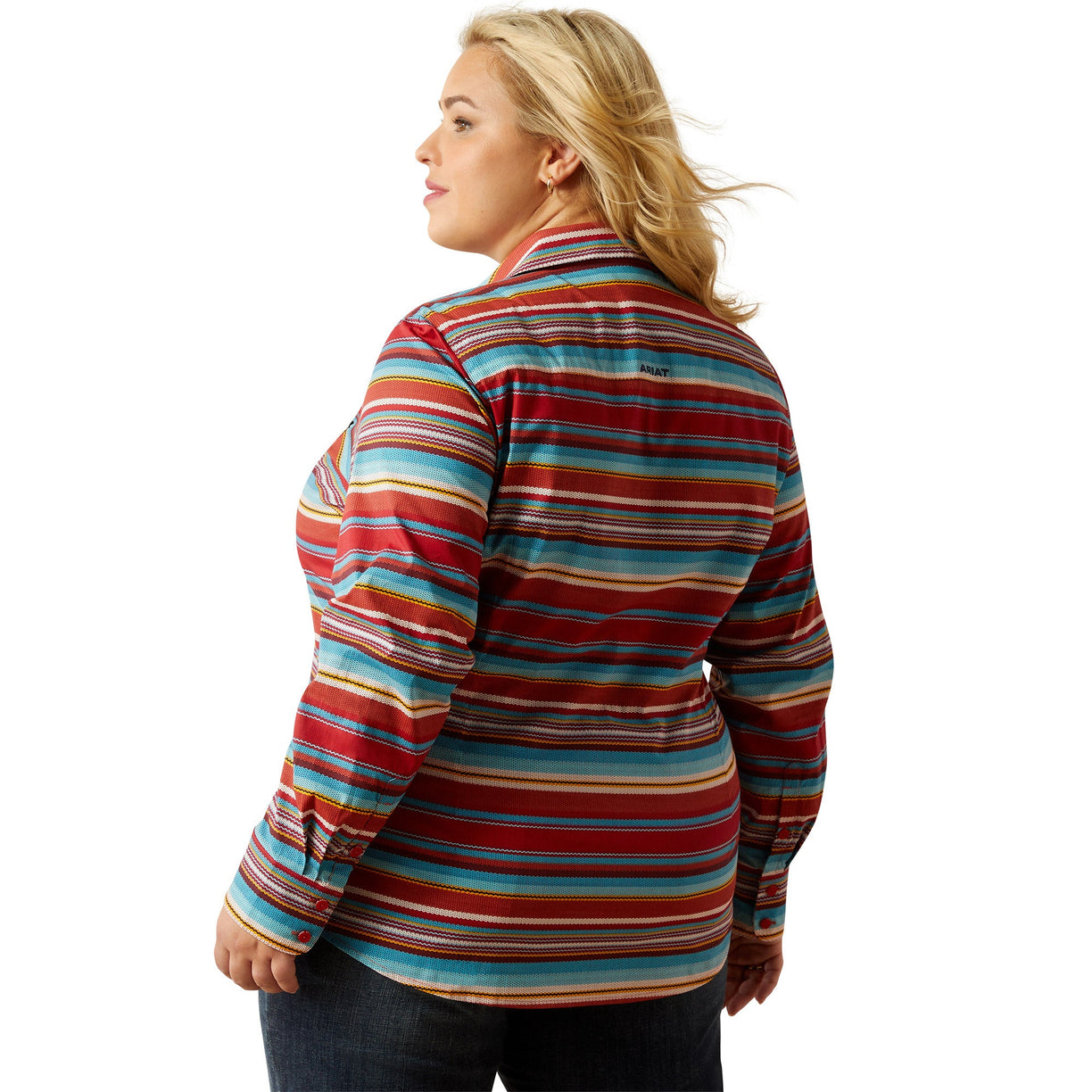 Woman wearing a colorful striped shirt on a white background