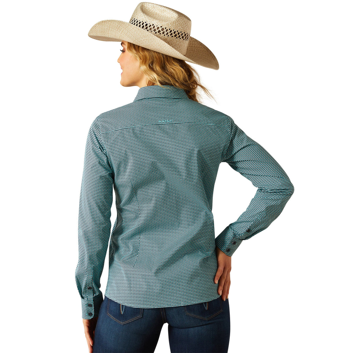 Woman wearing a teal patterned shirt and beige cowboy hat on a white background
