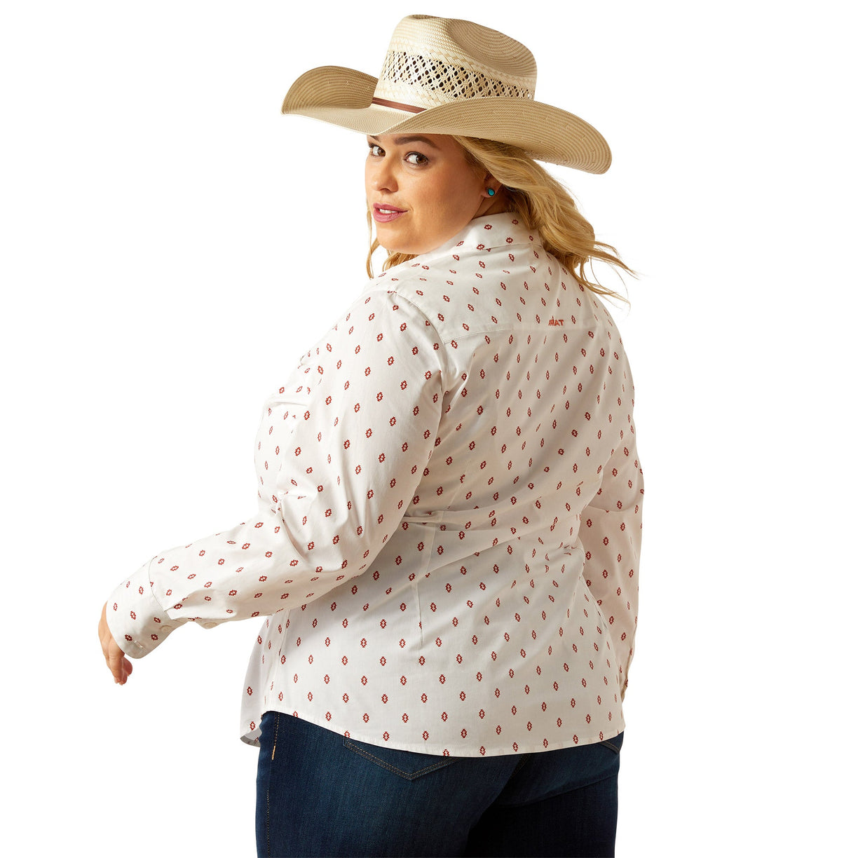 Woman wearing a white blouse with red patterns and a cowboy hat on a white background