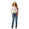 Woman wearing a white patterned shirt, blue jeans, and a cowboy hat on a white background