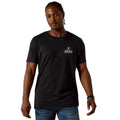Man wearing a black t-shirt with Ariat logo on a white background