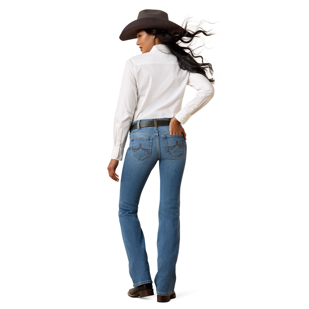 Woman wearing a white shirt, blue jeans, and a brown cowboy hat on a white background