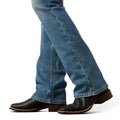 Blue jeans worn by a person on a white background