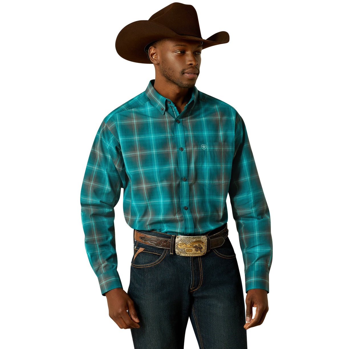 Man wearing a turquoise plaid shirt, dark jeans, and a brown cowboy hat on a white background
