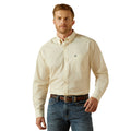 Man wearing a cream patterned shirt and blue jeans on a white background