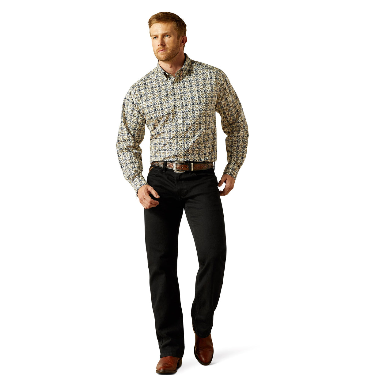 Man wearing a patterned shirt and black pants on a white background