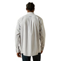 Person wearing a light gray long-sleeve shirt with a brand logo on the back, standing against a white background.