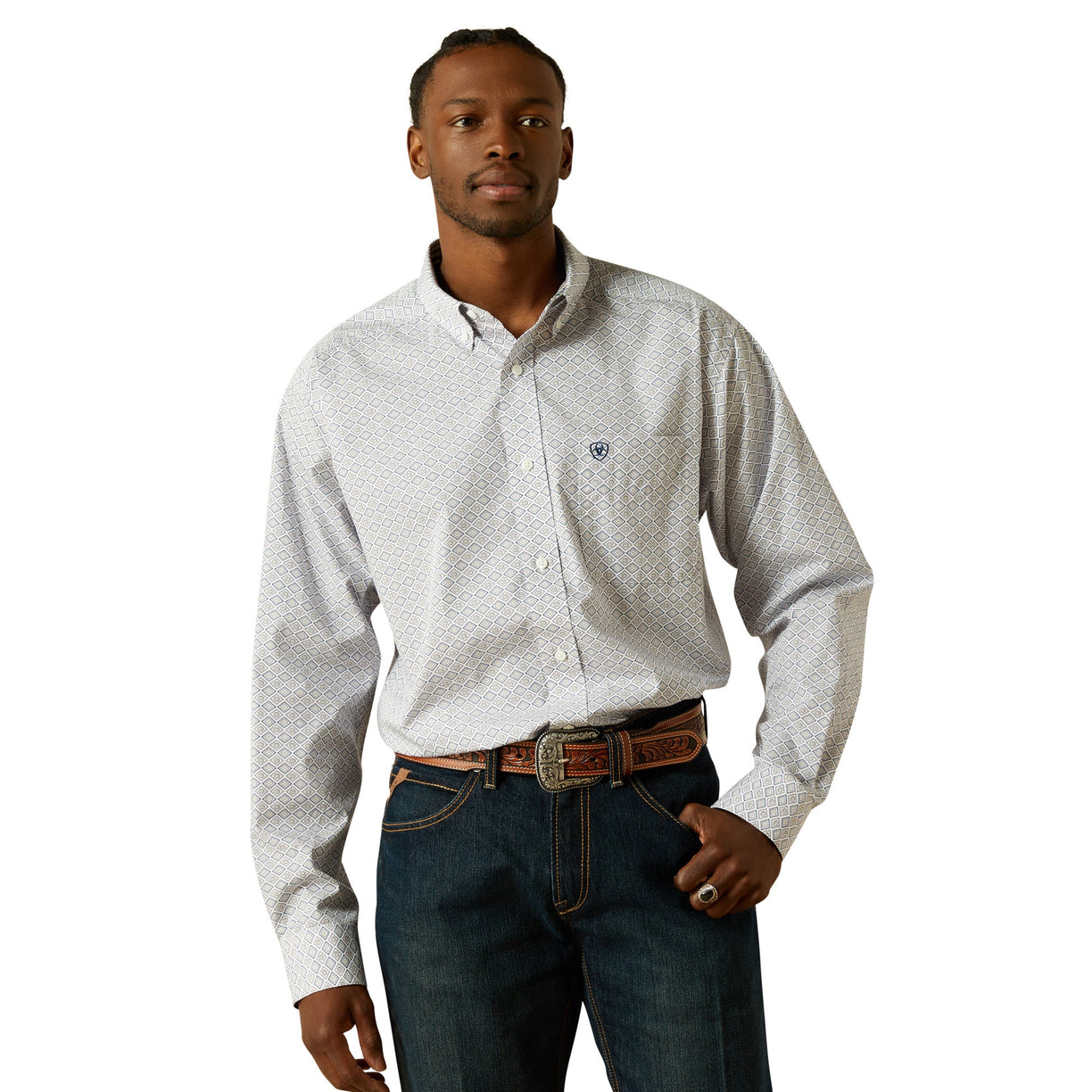 Man wearing a white patterned shirt and blue jeans on a white background