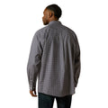 Man wearing a patterned shirt on a white background