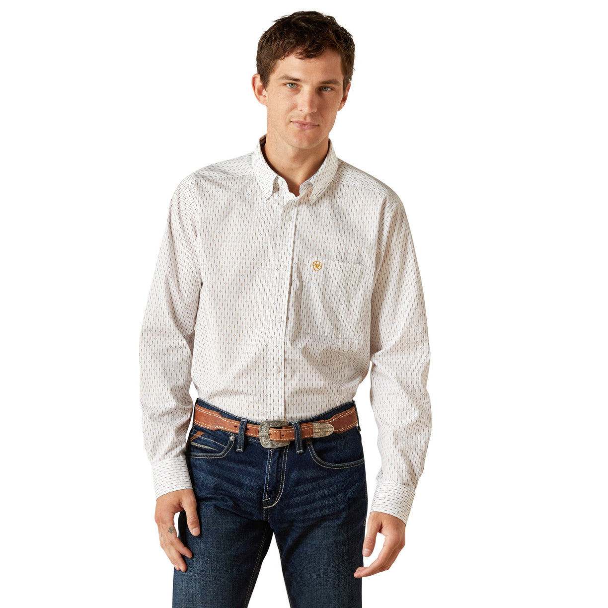 Man wearing a patterned white shirt and jeans on a white background