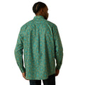 Person wearing a green patterned shirt on a white background