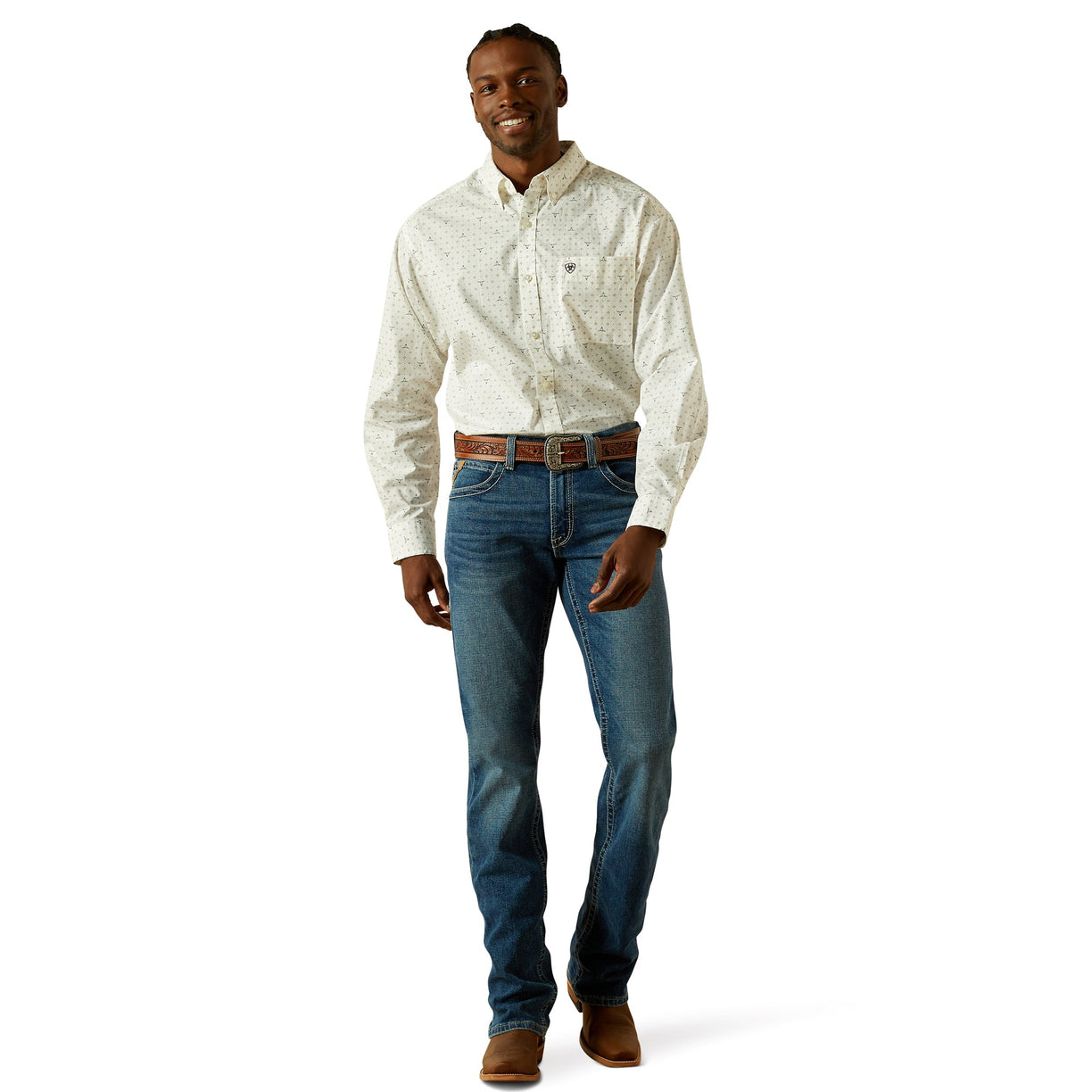 Man wearing a white patterned shirt and blue jeans on a white background