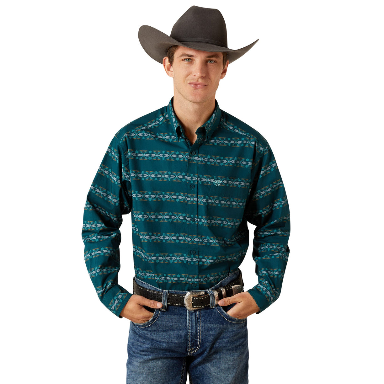 Man wearing a teal patterned shirt, jeans, and a cowboy hat on a white background