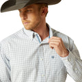 Man wearing a checkered shirt and cowboy hat on a white background