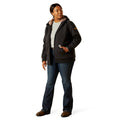 Person wearing a black jacket with a brand logo on a white background