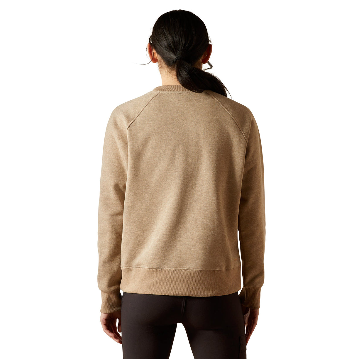 Person wearing a beige sweatshirt on a white background