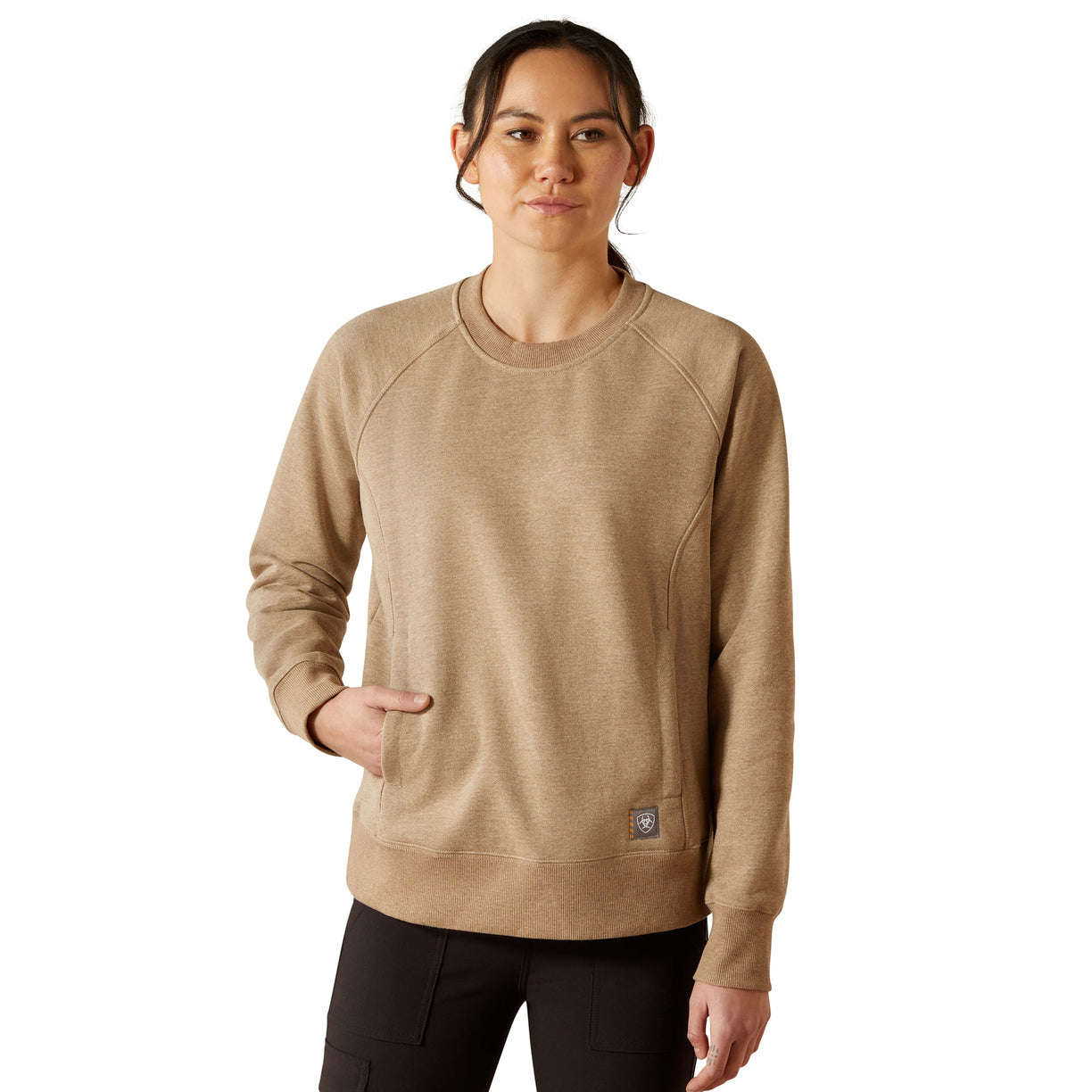Woman wearing a beige sweatshirt on a white background