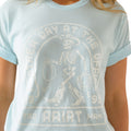 Light blue t-shirt with skeleton graphic and text on a person wearing it.