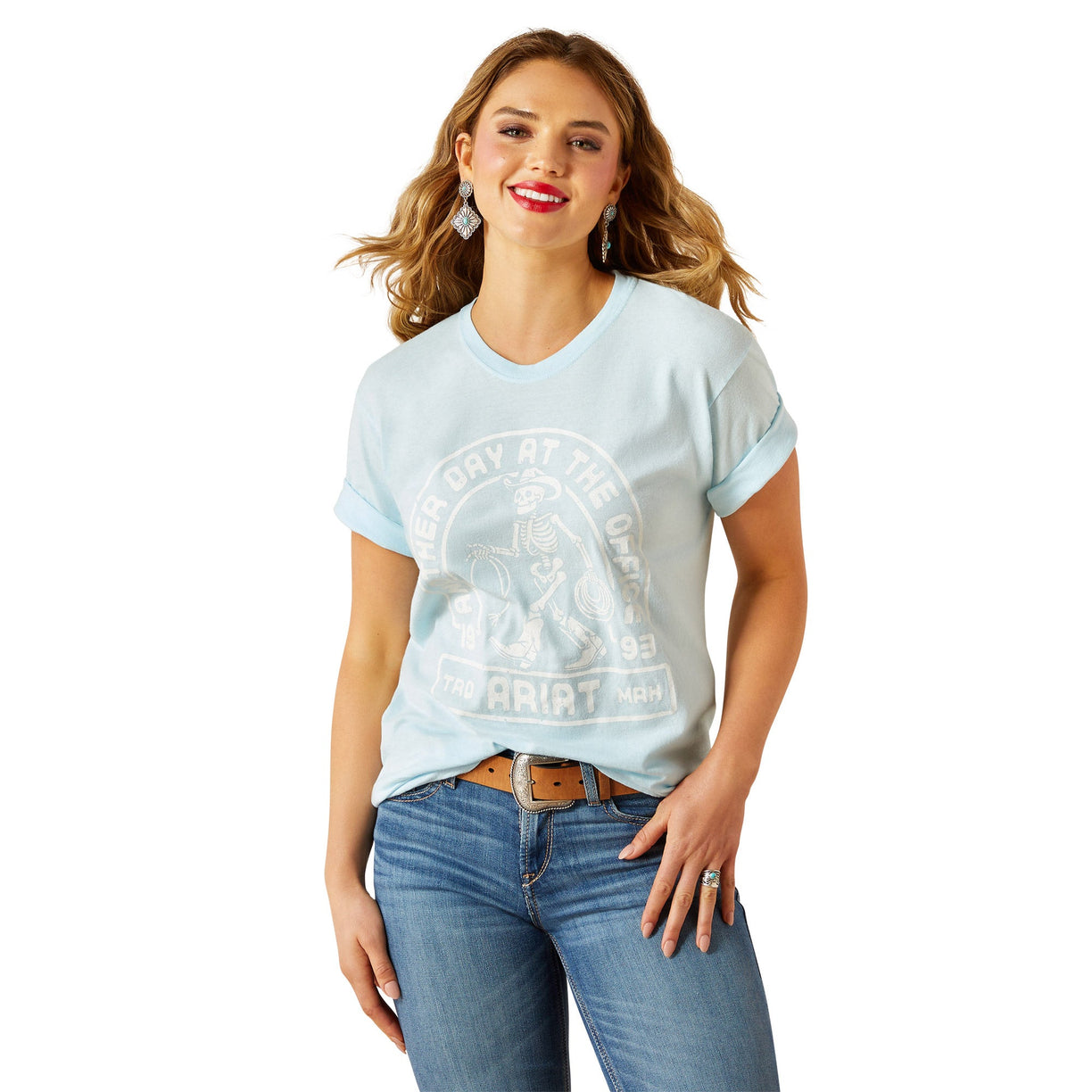 Woman wearing a light blue t-shirt with a graphic design on a white background