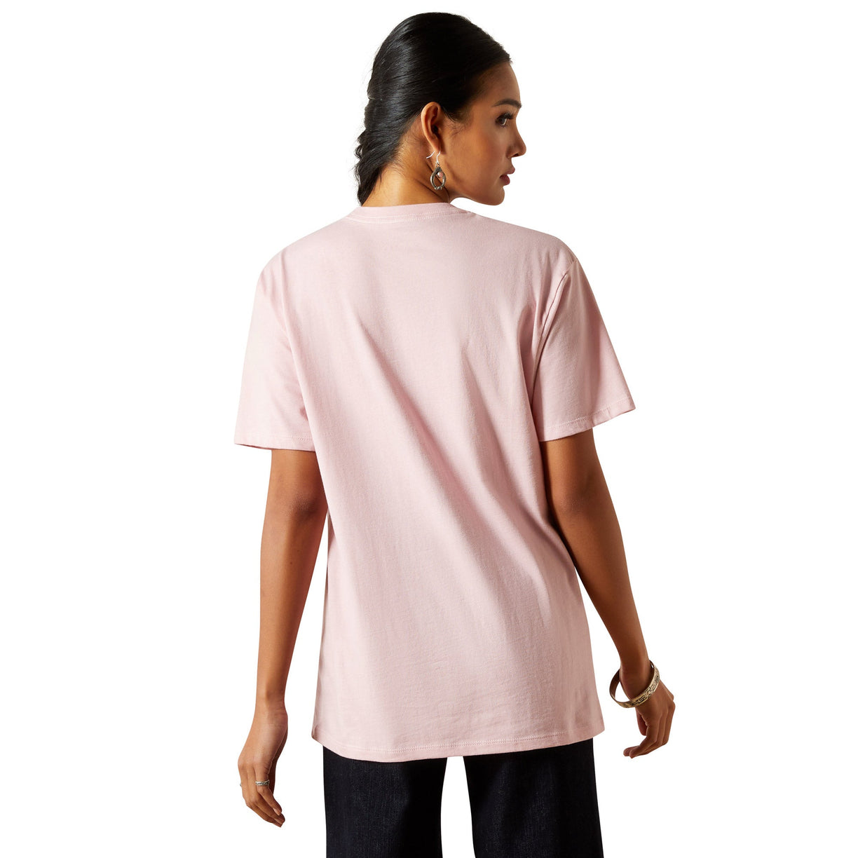 Woman wearing a light pink t-shirt on a white background