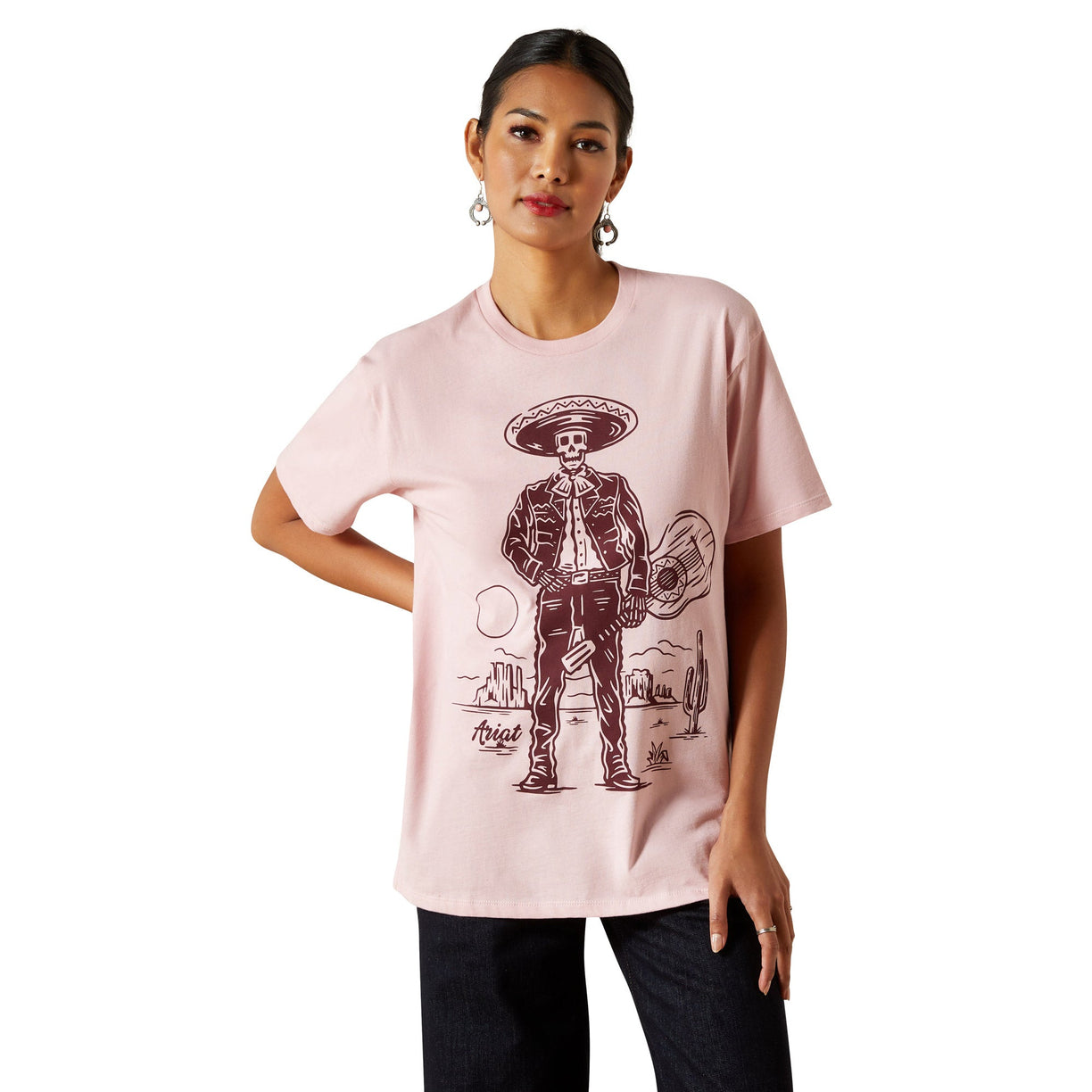 Woman wearing a pink t-shirt with a graphic design on a white background