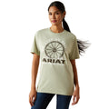 Woman wearing a light green Ariat t-shirt with a graphic design on a white background