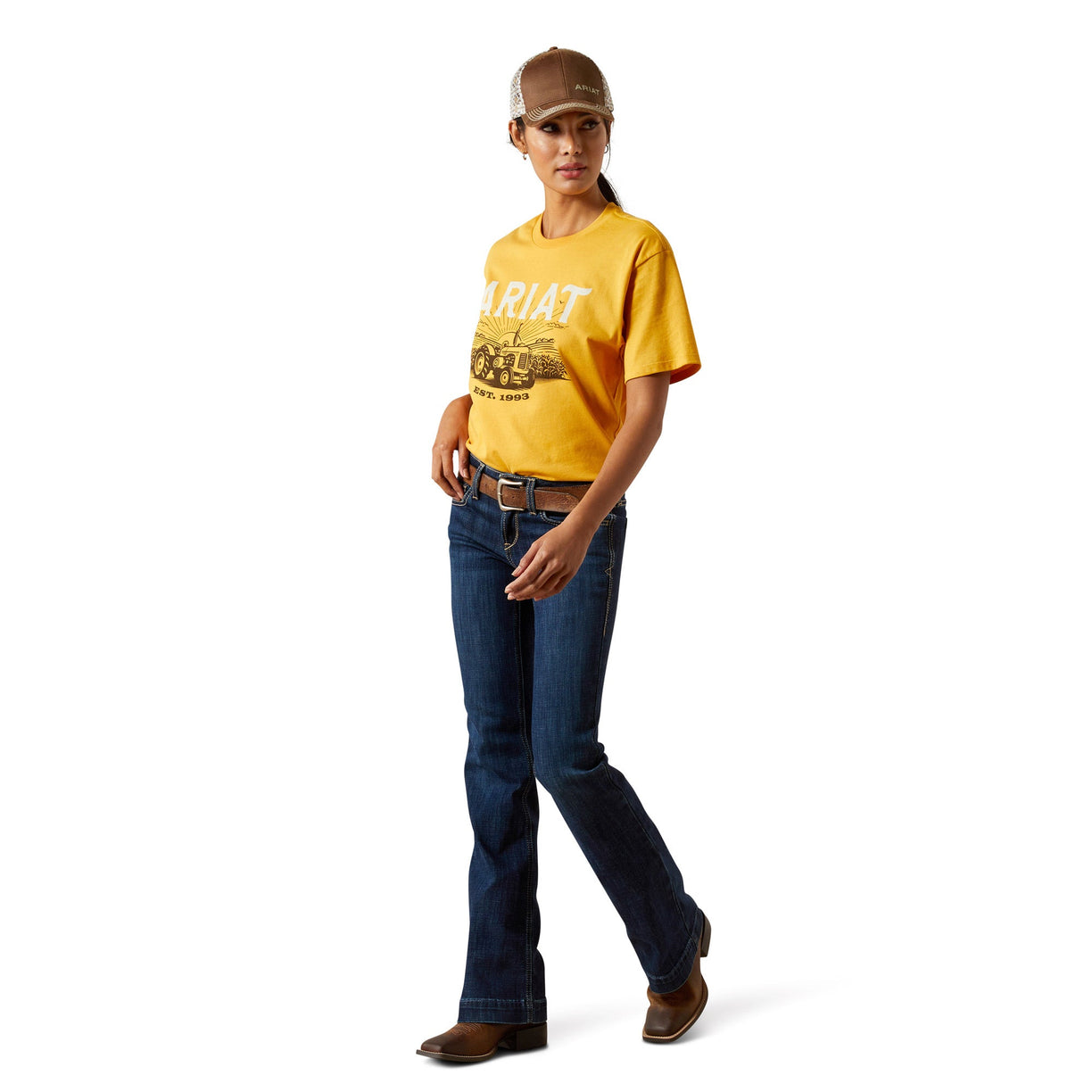 Person wearing a yellow t-shirt, blue jeans, and a cap on a white background