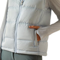 Light gray puffer vest worn by a person on a white background