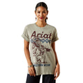 Woman wearing a beige t-shirt with 'Ariat Western Wear' graphic design on a white background