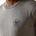 Gray t-shirt with a logo on the chest