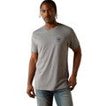Man wearing a gray t-shirt with a logo on a white background