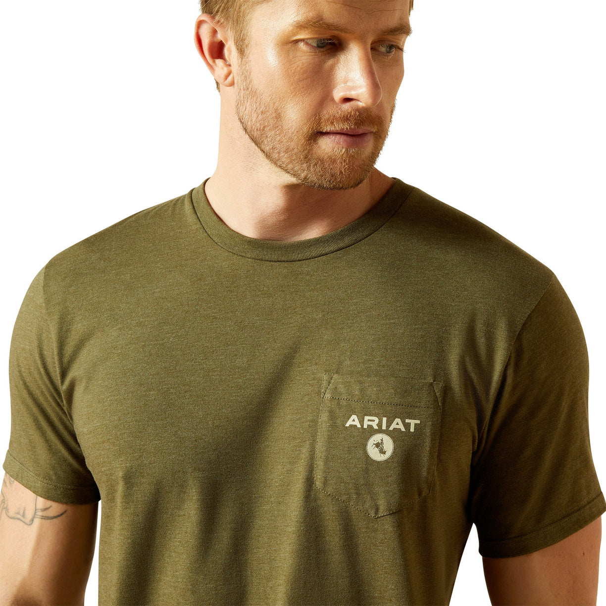 Man wearing a green Ariat t-shirt on a white background