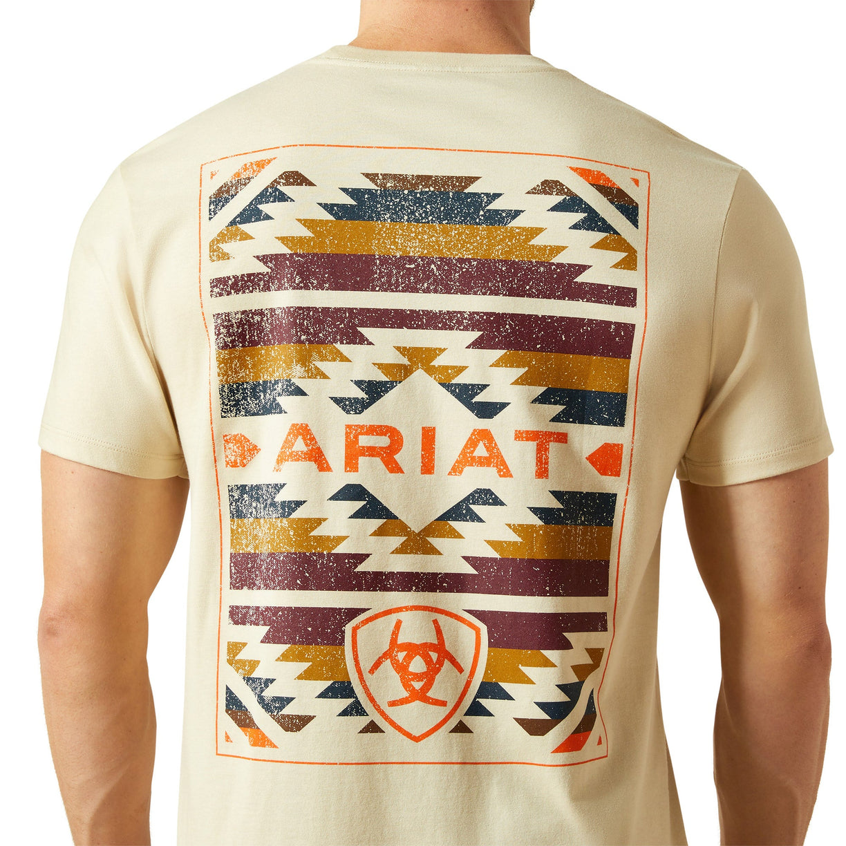 Beige t-shirt with geometric pattern and 'Ariat' branding on a white background