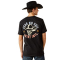 Person wearing a black t-shirt with a graphic design and a cowboy hat on a white background