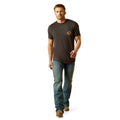 Man wearing a brown t-shirt and blue jeans on a white background