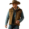 Man wearing a brown vest, blue shirt, and cowboy hat on a white background