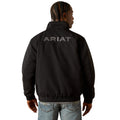 Person wearing a black Ariat jacket on a white background