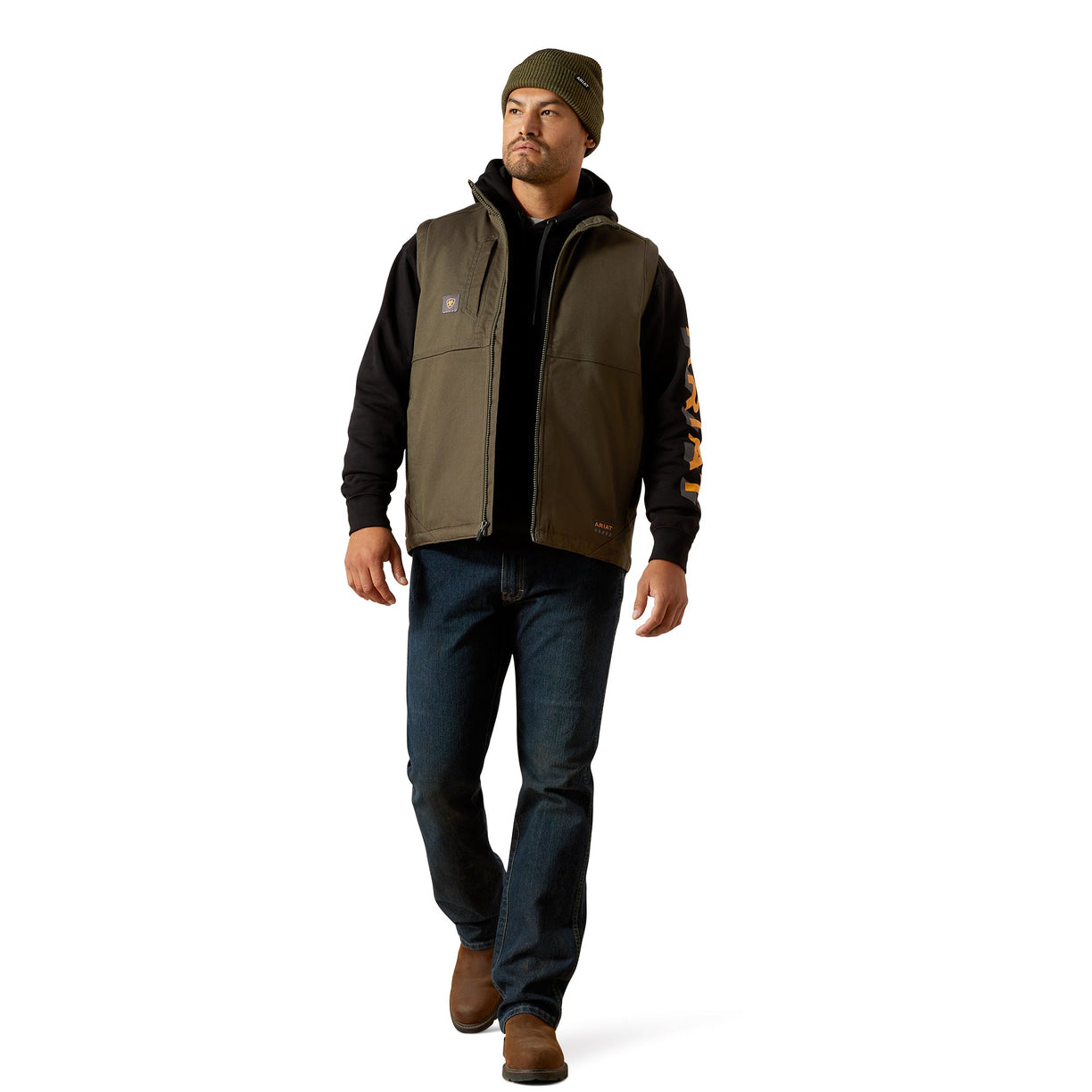 Man wearing a brown jacket with a hood, black shirt, blue jeans, and brown boots on a white background