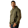 Man wearing a green hoodie with 'Ariat' branding on a white background